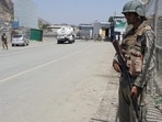 Pakistani soldiers patrol at the Torkham crossing between Pakistan and Afghanistan in Pakistan's Khyber region.