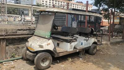 Neglected battery-operated vehicles rot in station yard