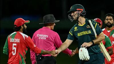 Australia's captain Mitchell Marsh shakes hands with Oman's players at the end of their match. (AFP) Australia's captain Mitchell Marsh shakes hands with Oman's players at the end of their match. (AFP)