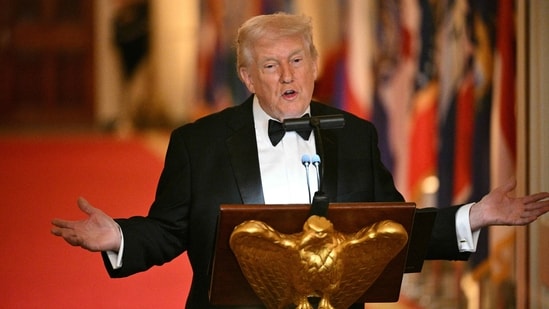 Donald Trump speaks during a dinner with state governors in the East Room of the White House in Washington, DC (AFP)