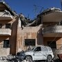 A destroyed vehicle lies next to a damaged building, in the aftermath of an Israeli strike on Friday, in Riyak, Bekaa valley, Lebanon, February 21, 2026. REUTERS/Mohamed Azakir