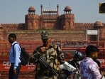 A security personnel outside the Red Fort on Monday. Police said a high alert was sounded across the city, and their counterparts in Uttar Pradesh and Haryana were informed to step up security at Metro stations in their jurisdictions as well. (Vipin Kumar/HT Photo)