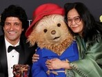 Paddington Bear poses with the winners of the Best Children and Family Film award for Boong  Lakshimipriya Devi and Farhan Akhtar, during the 2026 BAFTA Awards in London, February 22, 2026. REUTERS/Suzanne Plunkett
