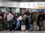 Stranded passengers line up at Guadalajara Airport in Tlajomulco, Jalisco, Mexico.