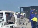 Protesting contract workers damaging a vehicle at the Panipat Refinery and Petrochemical Complex on Monday.