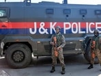 Security personnel stand guard outside the Congress headquarters during the Youth Congress's protest in Srinagar on Monday. (ANI)