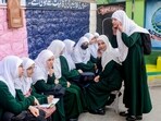 Students interact with each other at a school on the first day of classes after the winter vacation, in Srinagar, on Monday. (PTI)