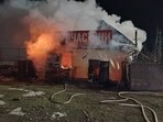 Firefighters work at a compound of a private enterprise which was damaged during overnight Russian drone strikes, amid Russia's attack on Ukraine, in Odesa region.