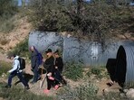TUCSON, ARIZONA - FEBRUARY 22: Volunteers search for any possible signs of Nancy Guthrie near her residence on February 22, 2026, in Tucson, Arizona. (Photo by JOE RAEDLE / GETTY IMAGES NORTH AMERICA / Getty Images via AFP)
