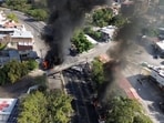Smoke billows, following a military operation in which a government source said Mexican drug lord Nemesio Oseguera, known as "El Mencho," was killed, in Puerto Vallarta, Jalisco, Mexico, 