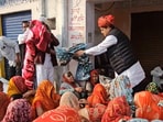In the video, the BJP leader is seen asking the names of the women, and after learning they are Muslims, he asks his aides not to give them blankets.