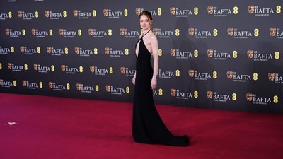 Emma Stone dazzles in minimalist glam, rocking a Louis Vuitton keyhole cutout black dress. Her makeup was also understated yet refined, sharp to match her dress. (Alberto Pezzali/Invision/AP) Emma Stone dazzles in minimalist glam, rocking a Louis Vuitton keyhole cutout black dress. Her makeup was also understated yet refined, sharp to match her dress. (Alberto Pezzali/Invision/AP)