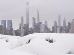 A piece of the New York skyline rises above a pile of snow on the Weekhawken, N.J. waterfront, Feb. 23.