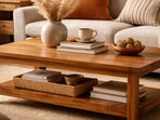 A warm wooden coffee table styled with books and ceramics brings character, charm and everyday function to a cosy living room.(AI generated)