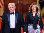 Donald Trump and Melania Trump attend a dinner with state governors in the East Room of the White House.