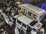 People gather around ambulances outside a hospital in Meerut. (PTI)