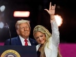 President Donald Trump stands with Erika Kirk at the conclusion of a memorial for her husband