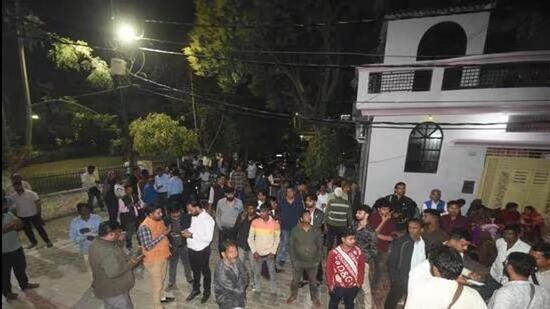 Neighbours gather at the house where the murder took place in Lucknow. (HT File)