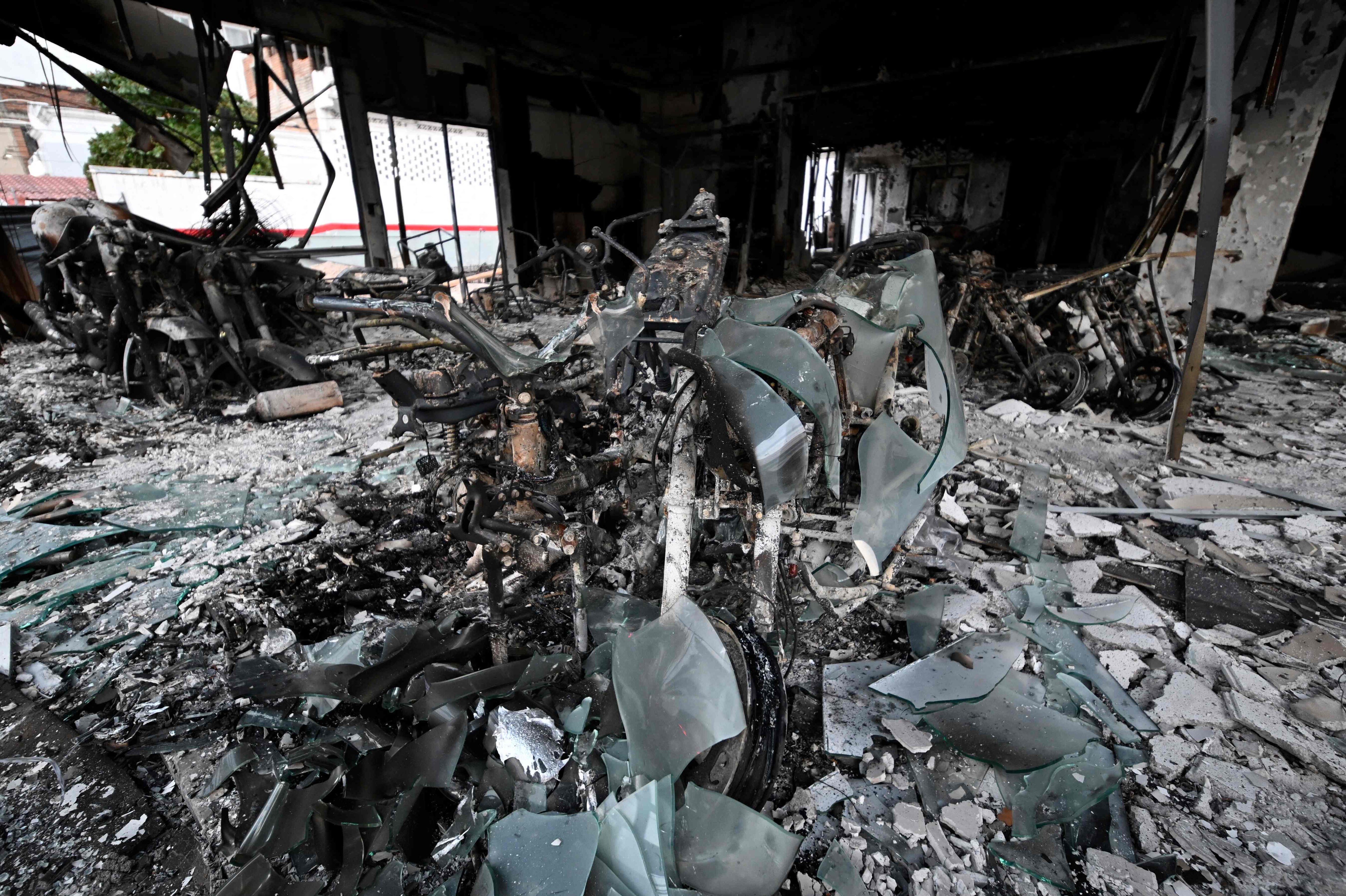 A burned-out motorcycle dealership is seen in Puerto Vallarta, Jalisco state, Mexico, on February 23, 2026. (AFP) A burned-out motorcycle dealership is seen in Puerto Vallarta, Jalisco state, Mexico, on February 23, 2026. (AFP)