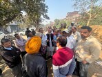 BJP leader Praveen Bansal and SAD leader RD Sharma visited the site and claimed that government land near the Shivpuri fish market was being encroached upon. (HT Photo)