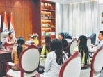 Chief minister Rekha Gupta interacts with the three northeastern women at her office. (HT Photo)