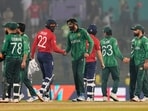 England's Jofra Archer, centre, and Liam Dawson shake hands after winning the T20 World Cup match between England and Pakistan in Pallekele