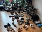 A picture shows several pairs of shoes placed outside an office 