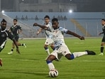 Players of FC Goa, in white, and Mohammedan Sporting Club vie for the ball during their ISL match. (PTI)