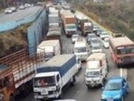 Pune, India - Feb. 20, 2016 : Massive traffic jam at Pune-Mumbai Expressway after an oil tanker toppled blocking the busy road route near Khandala exit in Pune, India, on Saturday, February 20, 2016. Traffic on Mumbai-Pune express way was restored after nine hours on Saturday after it was virtually standstill since morning. Vehicular movement from Mumbai and Pune remained affected when an oil tanker turned turtle around 6 am on stiff slope near Khandala exit.. Oil spilled over one km area, forcing authorities to block the road. Traffic was diverted from old national highway. But long queue -- almost eight to ten kms - from both the ends was seen till noon. It took almost six to eight hours to pass express way, which took 150 minutes in normal circumstance. Vehicle users faced severe hardships due to the mishap. HT photo (HT Photos)