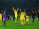 Bodo/Glimt's Nplayers celebrate their win at the end of the UEFA Champions League second-leg play-off match.