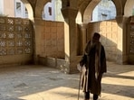 This afternoon, Fakeer Kashmir Baba is the lone visitor inside the monument. (HT)