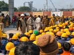 The workers resorted to stone pelting, while some of them, holding sticks, overturned a few vehicles