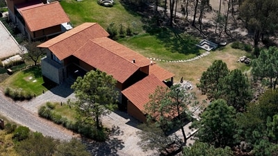 Local authorities initially asked tourists and residents to remain indoors as the operation unfolded. Those staying at the exclusive resort were eventually allowed to leave two days later, after security forces secured the area. Investigators believe Oseguera had been lying low at the resort with a companion, whom officials say played a role in helping authorities trace his location. Despite the cartel leader’s presence, he had largely avoided attention while staying at the Tapalpa Country Club. (Photo by Ulises RUIZ / AFP) (AFP)