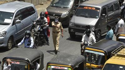 Mumbai, India - 19 May 2020: Traffic due to Samta Nagar Police takes action on Autorickshaw,Taxi and Two wheelers against the offenders who were travelling without valid permission during second day of Lockdown 4.0 at Western Express Highway,Kandivali in Mumbai, India, on Tuesday, May 19, 2020. (Photo by Pramod Thakur/ Hindustan Times) (Hindustan Times) Mumbai, India - 19 May 2020: Traffic due to Samta Nagar Police takes action on Autorickshaw,Taxi and Two wheelers against the offenders who were travelling without valid permission during second day of Lockdown 4.0 at Western Express Highway,Kandivali in Mumbai, India, on Tuesday, May 19, 2020. (Photo by Pramod Thakur/ Hindustan Times) (Hindustan Times)