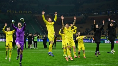 Bodo/Glimt's Nplayers celebrate their win at the end of the UEFA Champions League second-leg play-off match. (AFP)