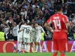 Real Madrid players celebrate their second goal.