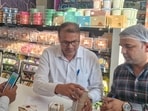 Late-night checks were conducted at the Noida Sector 12 vegetable market, where a team collected a khoya sample from a dairy. In another inspection, food safety officers collected samples of Cham Cham and paneer from a Sector 143 outlet, officials said. (HT Photos)