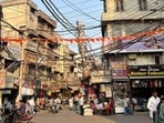 Tangled and low-hanging power cables loom over the crowded lanes of Ludhiana’s old city markets in Ludhiana on Thursday, February 26, 2026. (Manish)
