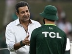 Wasim Akram in conversation with a Pakistani player