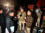Police officials from Delhi and Shimla in a conversation, in Shimla, Wednesday