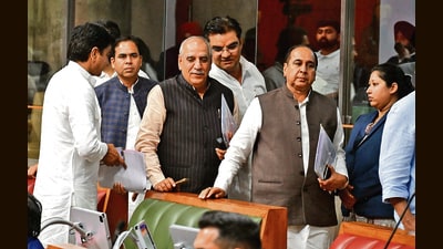 Congress members walking out of the assembly after boycotting the proceedings on Thursday. (HT) Congress members walking out of the assembly after boycotting the proceedings on Thursday. (HT)