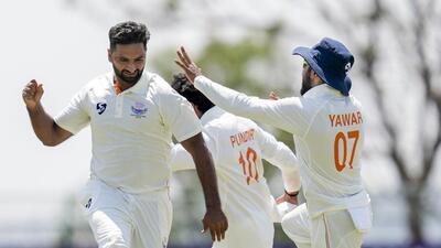 Jammu and Kashmir's Auqib Nabi celebrates after taking the wicket of Karnataka's Smaran Ravichandran. (PTI) Jammu and Kashmir's Auqib Nabi celebrates after taking the wicket of Karnataka's Smaran Ravichandran. (PTI)