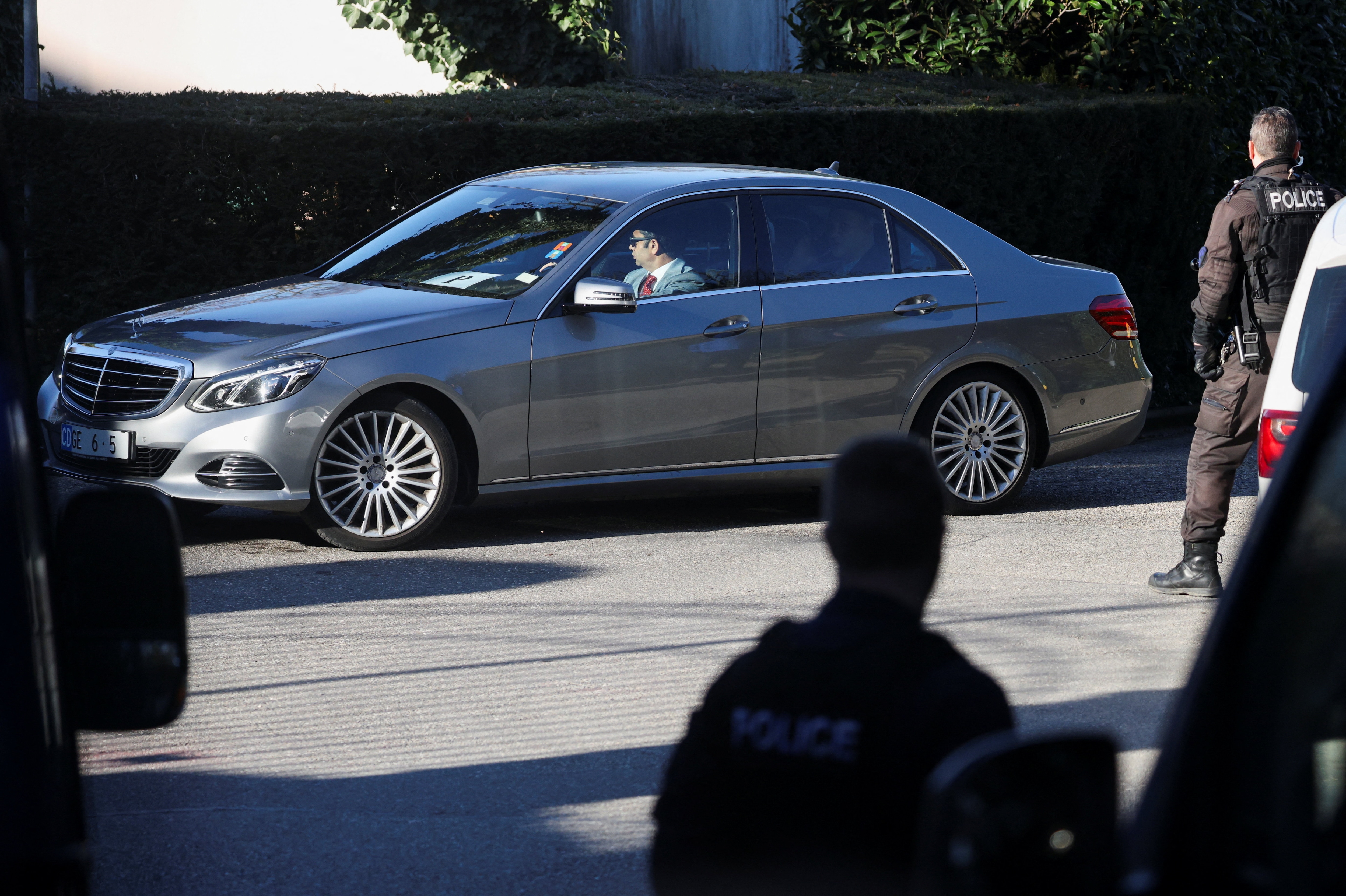 A diplomatic car carrying Iranian delegation drives near the residence of the Omani ambassador to the United Nations, believed to be the venue for indirect US-Iran talks, in Cologny, Switzerland, February 26, 2026.  (REUTERS/Florion Goga)