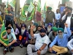 Farmers protest at Ladhowal toll plaza in Ludhiana on Friday. (Gurpreet Singh//HT)