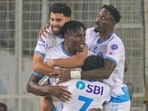 Jamshedpur FC’s Stephen Eze is hugged by Mehdi Talal (behind), Raphael Messi Bouli (right) and Vincy Barreto after scoring the equaliser against East Bengal in ISL 12 at Salt Lake stadium in Kolkata on Friday. (Jamshedpur FC)