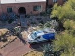 In an aerial view, a Comcast vehicle sits in the driveway of Nancy Guthrie's home on February 26 In an aerial view, a Comcast vehicle sits in the driveway of Nancy Guthrie's home on February 26