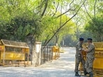 Security stands guard at the JNU campus gate in New Delhi on Friday. (Vipin Kumar/HT PHOTO)