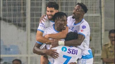 Jamshedpur FC’s Stephen Eze is hugged by Mehdi Talal (behind), Raphael Messi Bouli (right) and Vincy Barreto after scoring the equaliser against East Bengal in ISL 12 at Salt Lake stadium in Kolkata on Friday. (Jamshedpur FC) Jamshedpur FC’s Stephen Eze is hugged by Mehdi Talal (behind), Raphael Messi Bouli (right) and Vincy Barreto after scoring the equaliser against East Bengal in ISL 12 at Salt Lake stadium in Kolkata on Friday. (Jamshedpur FC)