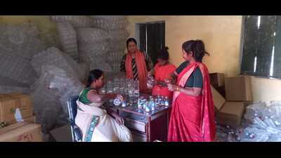 Namita Singh (in salwar suit) with fellow rural women at the bottle packaging plant in Jasra, Prayagraj (HT) Namita Singh (in salwar suit) with fellow rural women at the bottle packaging plant in Jasra, Prayagraj (HT)