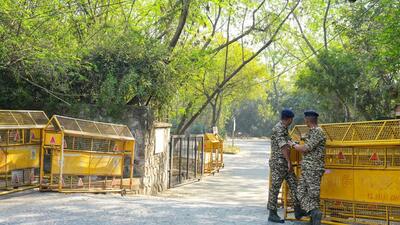Security stands guard at the JNU campus gate in New Delhi on Friday. (Vipin Kumar/HT PHOTO) Security stands guard at the JNU campus gate in New Delhi on Friday. (Vipin Kumar/HT PHOTO)